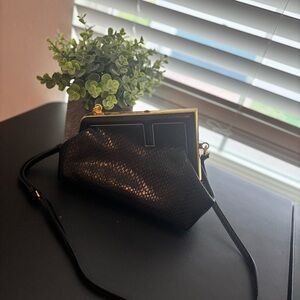Elegant Black Clutch with Gold Accents
